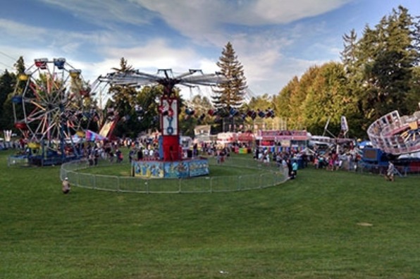 Attendees at West Linn's Old Time Fair enjoy carnival rides and game and food booths