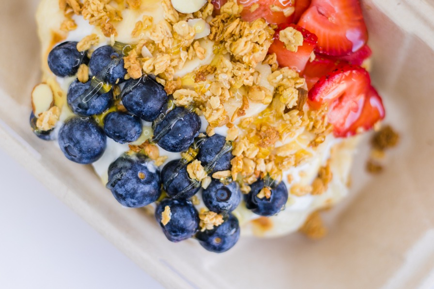 Waffle with granola, blueberries, and strawberries from the Freckled Peach