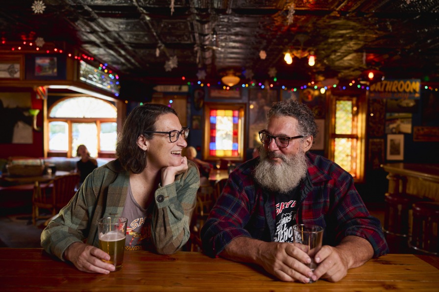 Two people drinking beer at Villages Skyway