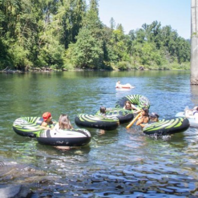 People floating on inner tubes on the Clackamas River