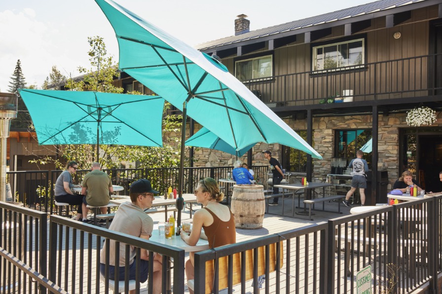 People dinking beer in outdoor seating area