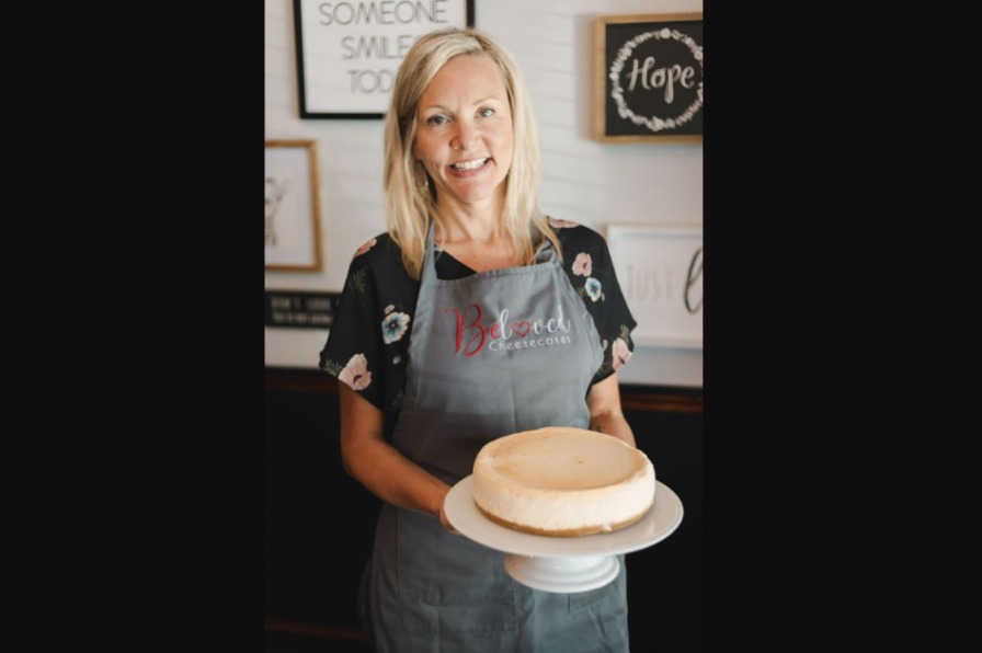 Woman holding cheesecake
