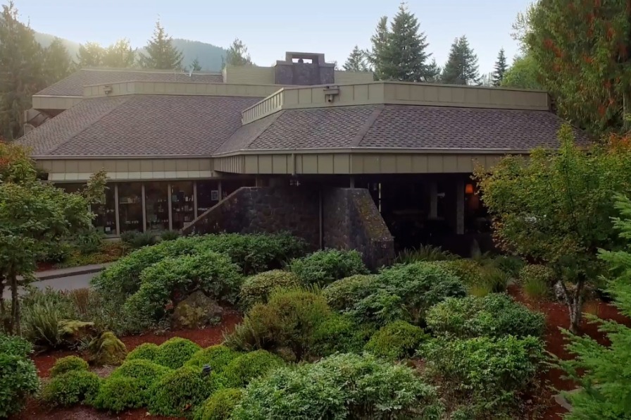 Outdoor of a resort building surrounded by green trees