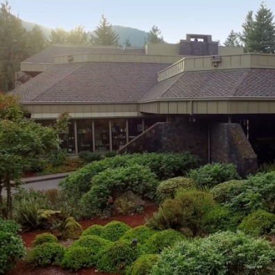 Outdoor of a resort building surrounded by green trees