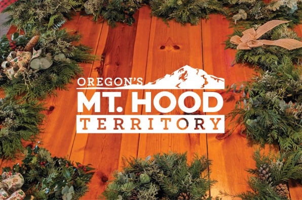 Logo for Oregon's Mt. Hood Territory overlayed on an image of a wreaths on a table.