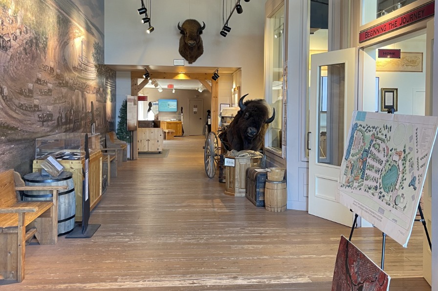 A wood hallway with old artifacts on the walls