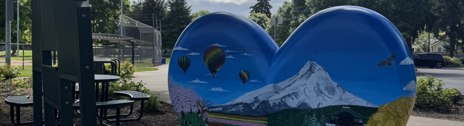 A painted heart sculpture with Mt. Hood on it.