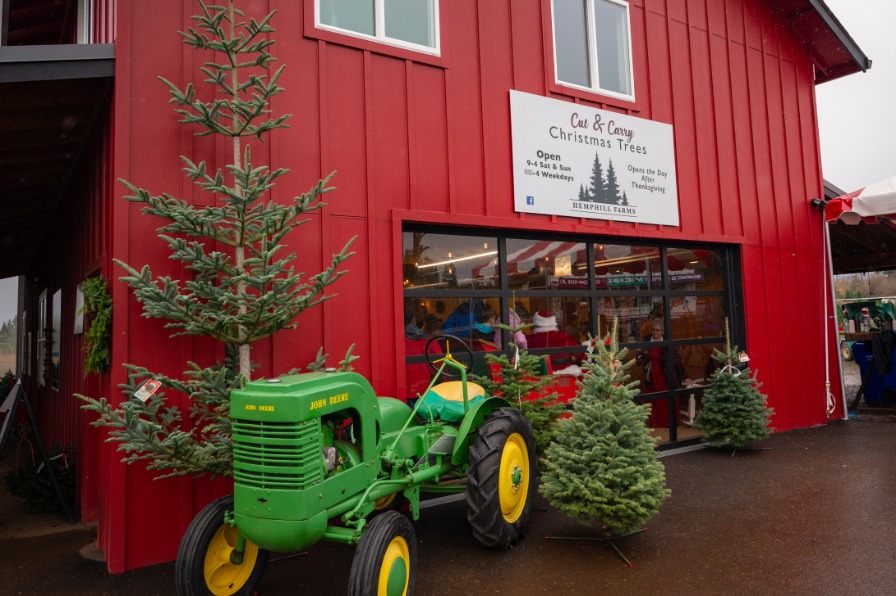 A red barn with a green tractor