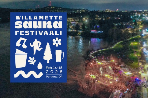 Nighttime drone view of a festival in Milwaukie Bay Park with softly lit tents. 