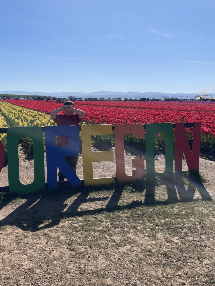 A person stands with words that read OREGON