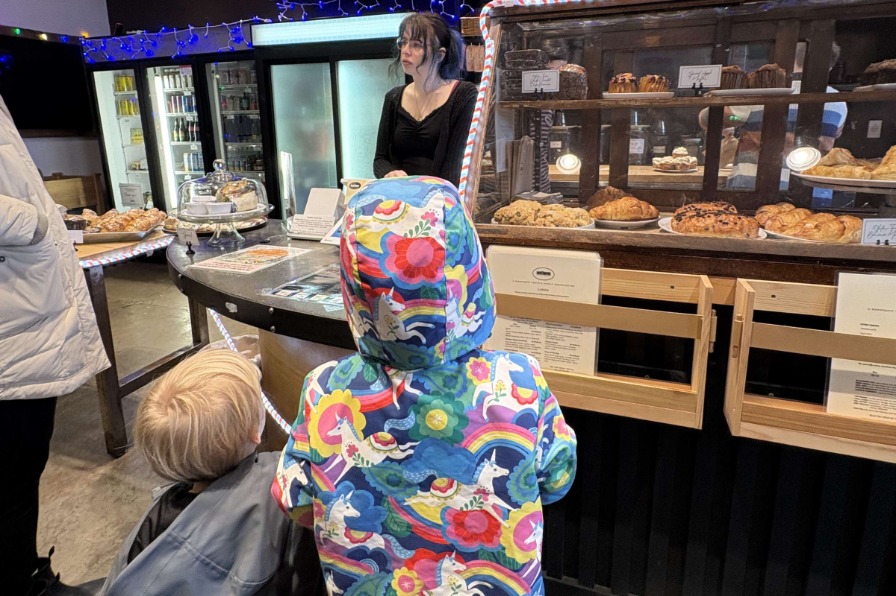 AntFarm Cafe in Sandy, Oregon. Two children look at bakery items behind glass