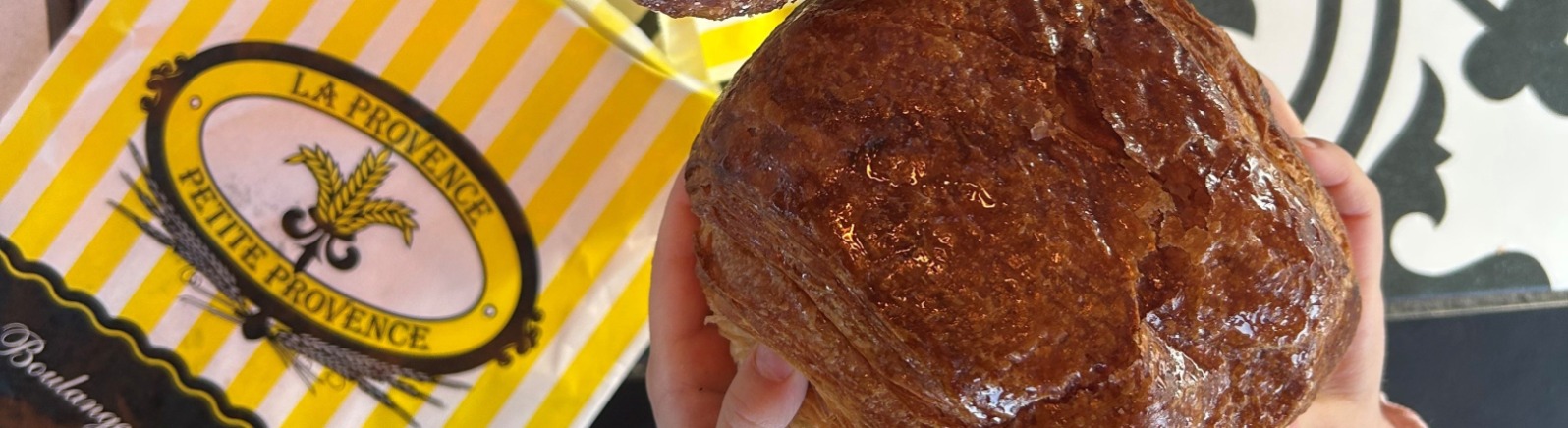 Almond and chocolate croissants on black and white bistro table