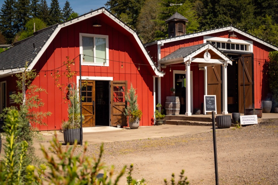 A red barn with white trim
