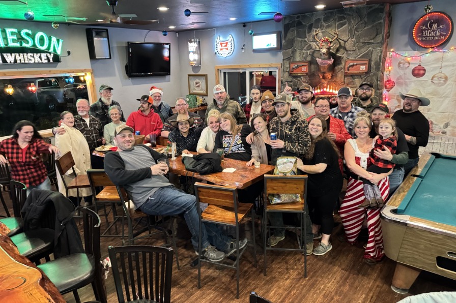 Fir Valley Pour House A group of customers sit around a tables