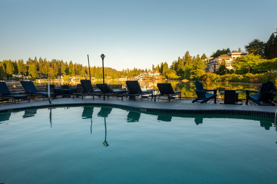 The Lakeshore Inn A pool with chairs