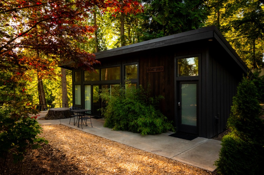 The Goat Shed A building surrounded with trees