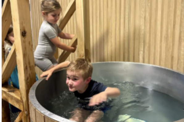 Children try out the cold plunge tank at SaunaGlo's Family Nite Out Event