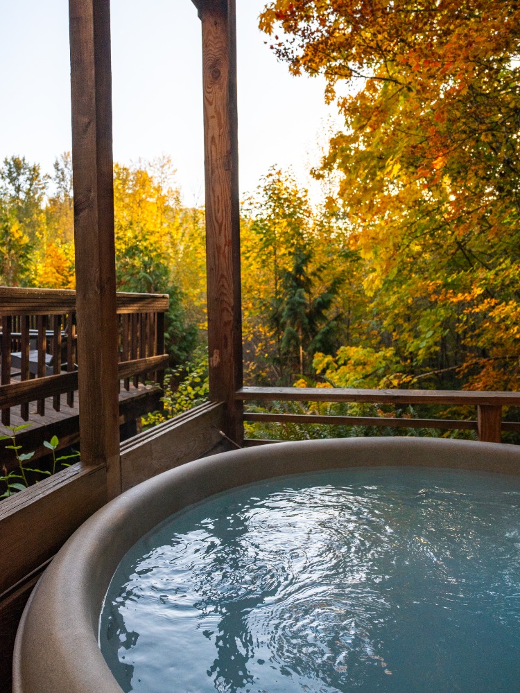 Hot tub surrounded by fall foliage