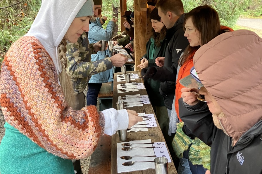 Oregon Maple Project People gather around spoons of syrup to taste