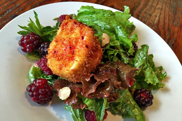 Cooking class salad with leafy greens and boysenberries at The Kitchen at Middleground Farms in Wilsonville